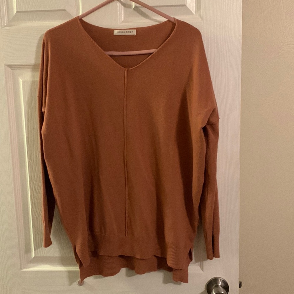 mauve sweater. v neck, shorter in front longer in back